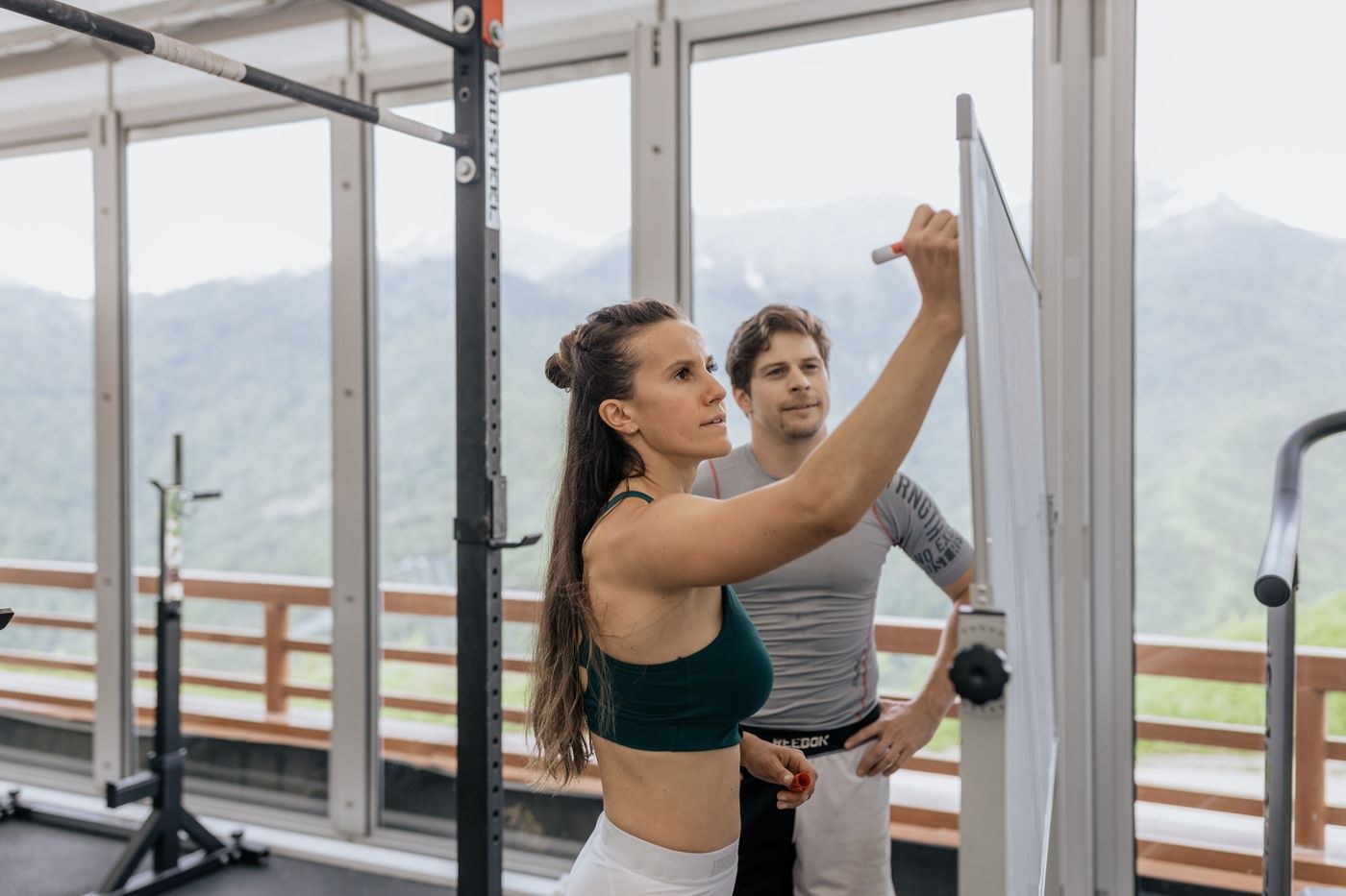 An instructor writing training notes on a whiteboard.